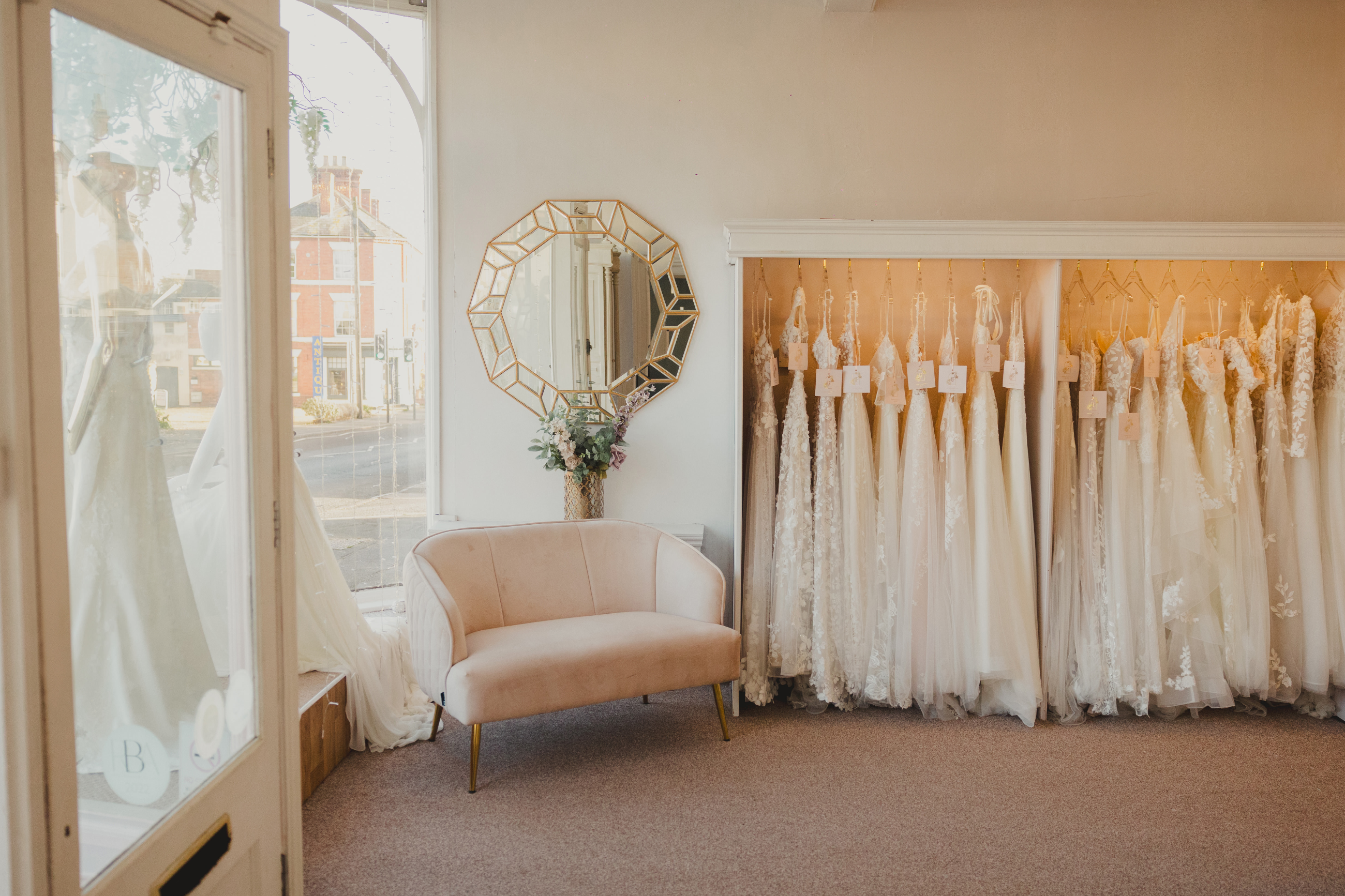 image shows a rack of wedding dresses in serendipity brides in the uk