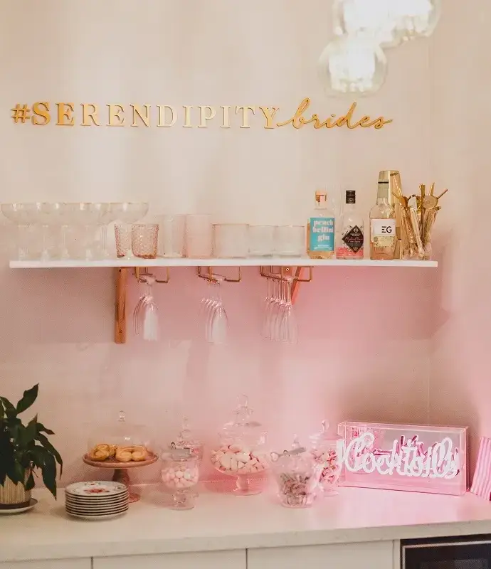 A decorative bar setup with gold lettering reading 